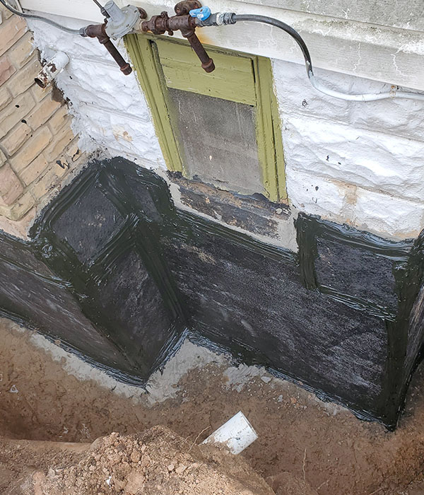 Water proofing outside house foundation